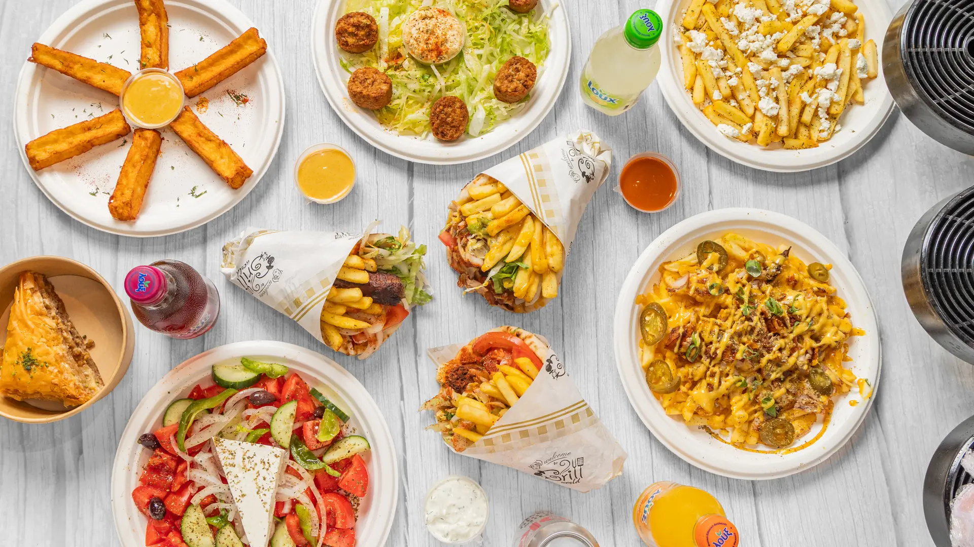 Overhead spread of Athens Original Gyros dishes